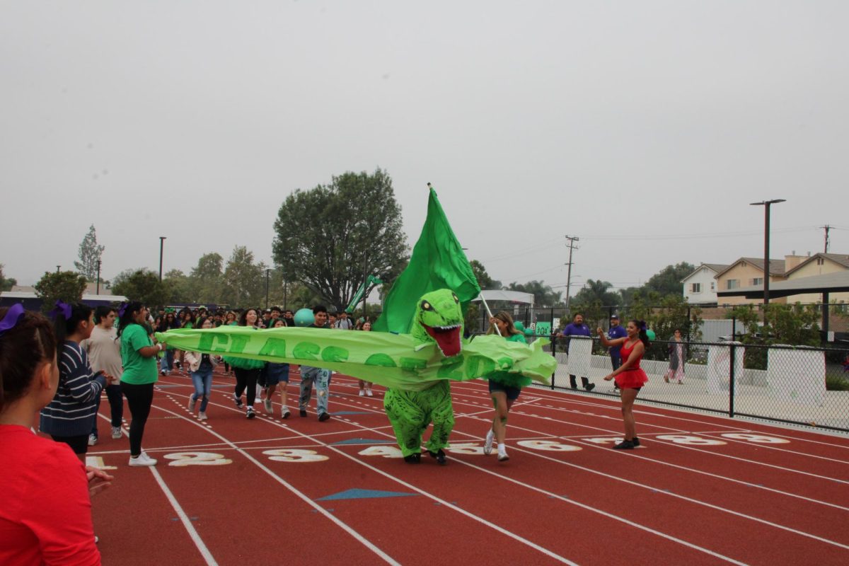 Monserratt Gutierrez in costume leading the Seniors as the rally starts.