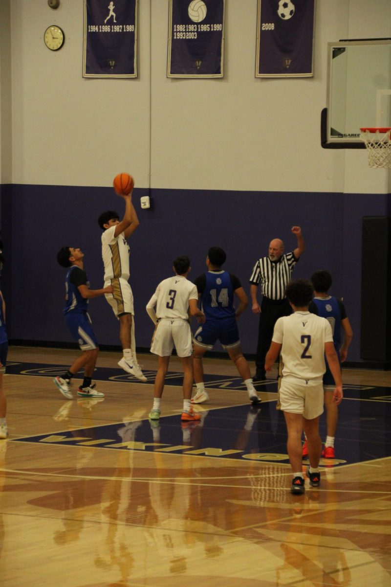 Senior Christopher Duran (#1) with an and-1 midrange jumper.