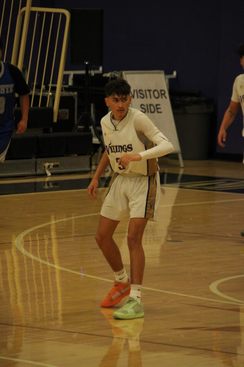 Senior Adrian Peralta (#3) on the defensive side of the court.